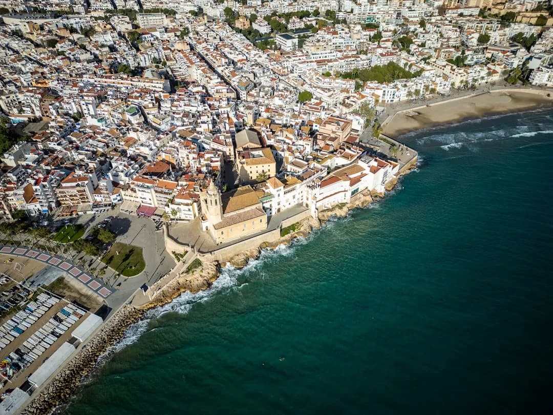 Migrants cross the shoreline into Ceuta from Morocco